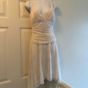 White handkerchief bottom dress with glitter flecks in fabric. Size large